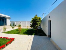 A villa with a beautiful yard and swimming pool is for sale in Mardakan
, -6
