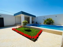 A villa with a beautiful yard and swimming pool is for sale in Mardakan
, -8