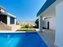A villa with a beautiful yard and swimming pool is for sale in Mardakan
, -10